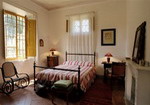 la chambre à coucher de l'appartement Ballatina dans le parc du Château de Grotti, à 12 km de Sienne en Toscane